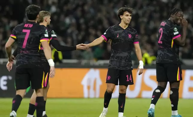 Chelsea's Joao Felix, second from right, celebrates with his teammates after scoring his side's third goal during the Europa Conference League opening phase soccer match between Panathinaikos and Chelsea at the Olympic stadium in Athens, Greece, Thursday, Oct. 24, 2024. (AP Photo/Petros Giannakouris)