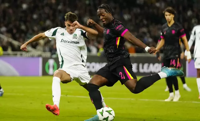 Chelsea's Axel Disai, right, challenges for the ball with Panathinaikos' Georgios Vagiannidis during the Europa Conference League opening phase soccer match between Panathinaikos and Chelsea at the Olympic stadium in Athens, Greece, Thursday, Oct. 24, 2024. (AP Photo/Petros Giannakouris)