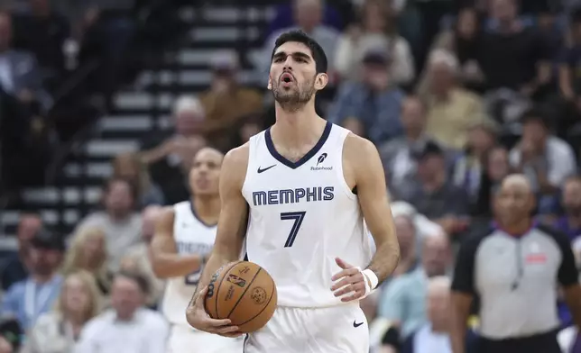 Memphis Grizzlies forward Santi Aldama (7) reacts to a play against the Utah Jazz during the first half of an NBA basketball game, Wednesday, Oct. 23, 2024, in Salt Lake City. (AP Photo/Rob Gray)