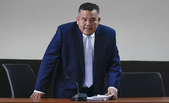 Judge Erick Garcia Alvarado arrives to a courtroom for a hearing requested by Guatemalan journalist Jose Ruben Zamora, founder of El Periodico newspaper, jailed for more than two years on money laundering charges, in Guatemala City, Friday, Oct. 18, 2024. (AP Photo/Moises Castillo)