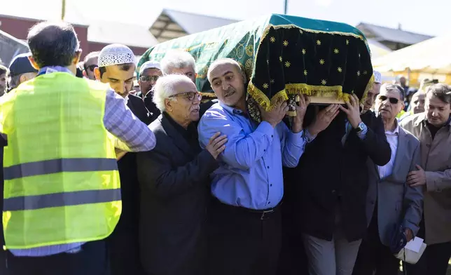 Mourners carry the casket of Fethullah Gülen, an influential Turkish spiritual leader and Islamic scholar who died this week in self-exile in the United States, at a funeral prayer service, Thursday, Oct, 24, 2024, in Augusta, N.J. (AP Photo/Eduardo Munoz Alvarez)