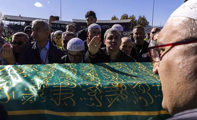 Mourners carry the casket of Fethullah Gülen, an influential Turkish spiritual leader and Islamic scholar who died this week in self-exile in the United States, at a funeral prayer service, Thursday, Oct, 24, 2024, in Augusta, N.J. (AP Photo/Eduardo Munoz Alvarez)