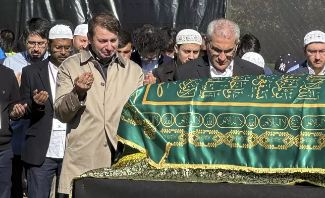 A casket bearing the body of Fethullah Gülen, a Muslim cleric living in exile in the United States who faced unproven allegations that he orchestrated a failed 2016 coup in Turkey, sits in Skylands Stadium in Augusta, N.J., where thousands gathered for funeral prayers, Thursday, Oct. 24. 2024. (AP Photo/Mike Rubinkam)