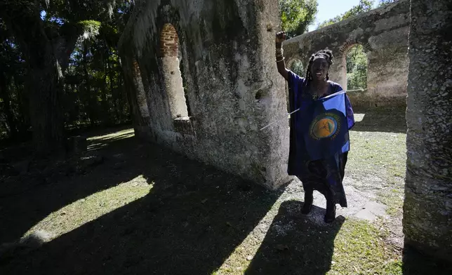 FILE - Marquetta Goodwine, a local community leader who is also known as "Queen Quet", speaks to Associated Press journalists about Gullah Geechee history, at the ruins of the Chapel of Ease, where plantation owning families would attend church services, on St. Helena Island, S.C., on Oct. 29, 2021. (AP Photo/Rebecca Blackwell, File)