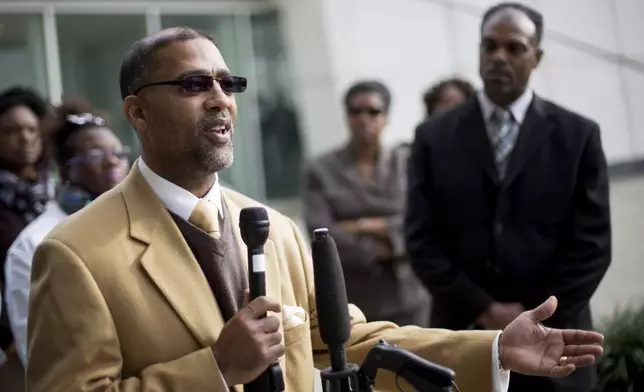 FILE - Sapelo Island, Ga., descendant and land owner Reginald Hall speaks at a news conference outside federal court, Dec. 9, 2015, in Atlanta. (AP Photo/David Goldman, File)