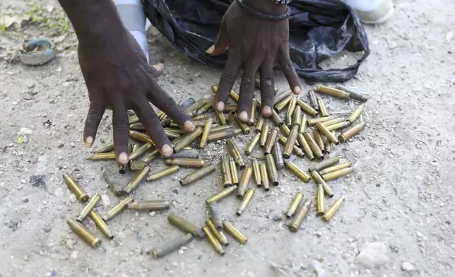 Local Frantz Baptist shows bullet casings he collected from the streets near his home days after an armed gang attack on Pont-Sonde, Haiti, Tuesday, Oct. 8, 2024. (AP Photo/Odelyn Joseph)