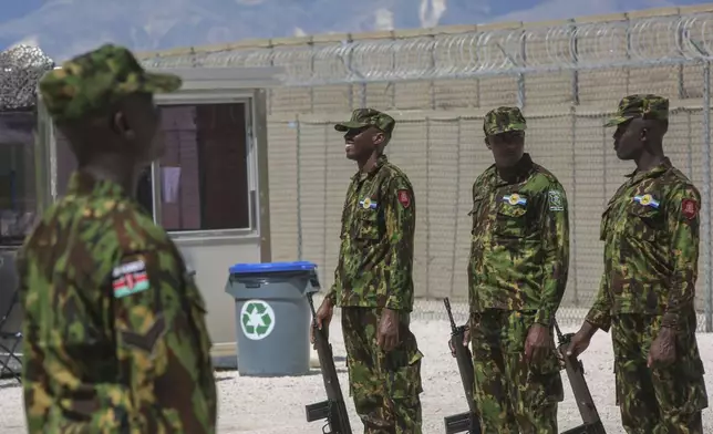 Kenyan police officers, part of a UN-backed multinational force, stand in formation on their base during a visit by Kenya's President William Ruto, in Port-au-Prince, Haiti, Saturday, Sept. 21, 2024. (AP Photo/Odelyn Joseph)