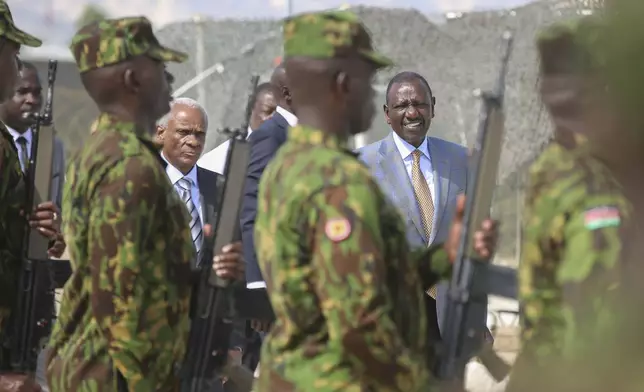 Kenya's President William Ruto, right, and Transition Council President Edgard Leblanc, arrive to the Kenyan base in Port-au-Prince, Haiti, Saturday, Sept. 21, 2024. (AP Photo/Odelyn Joseph)