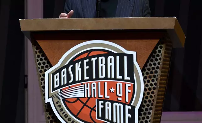 Comedian Billy Crystal speaks during a ceremony at the Basketball Hall of Fame, Sunday, Oct. 13, 2024, in Springfield, Mass. Crystal, actor Jack Nicholson, film director Spike Lee and businessman Alan Horwitz are being added to the Naismith Memorial Basketball Hall of Fame's James F. Goldstein SuperFan Gallery. (AP Photo/Jessica Hill)