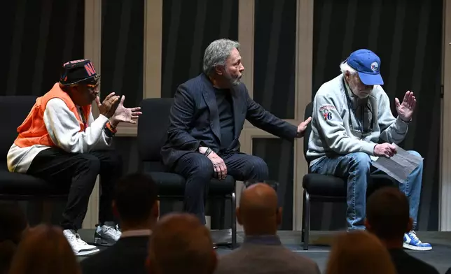 Businessman Alan Horwitz, right, reacts while speaking as film director Spike Lee, left, and comedian Billy Crystal, center, looks on as they are all honored at a superfan ceremony at the Basketball Hall of Fame, Sunday, Oct. 13, 2024, in Springfield, Mass. Horwitz, Lee, Crystal and actor Jack Nicholson are being added to the Naismith Memorial Basketball Hall of Fame's James F. Goldstein SuperFan Gallery. (AP Photo/Jessica Hill)