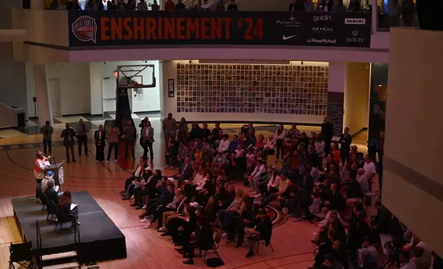 Film director Spike Lee, upper left, speaks at a superfan ceremony at the Basketball Hall of Fame, Sunday, Oct. 13, 2024, in Springfield, Mass. Lee, actor Jack Nicholson, comedian Billy Crystal and businessman Alan Horwitz are being added to the Naismith Memorial Basketball Hall of Fame's James F. Goldstein SuperFan Gallery. (AP Photo/Jessica Hill)