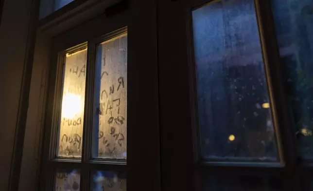 The words "run" and "ah" are seen on a window during a tour of underground passages on Thursday, Oct. 17, 2024, in Portland, Ore. (AP Photo/Jenny Kane)