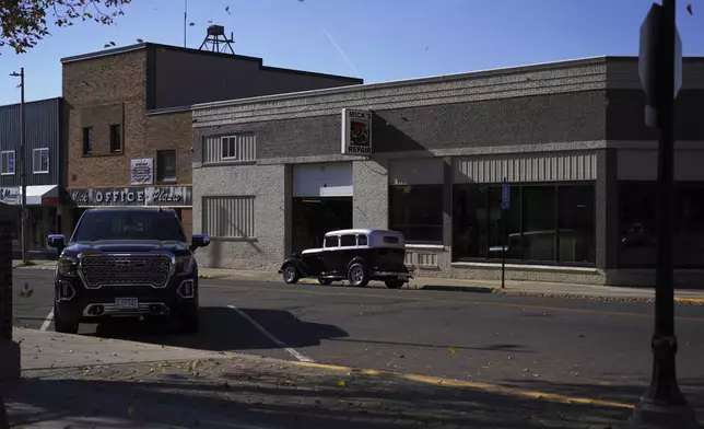 A classic car sits in front of Mick’s Repair in Worthington, Minn., on Tuesday, Oct. 22, 2024. (AP Photo/Jessie Wardarski)