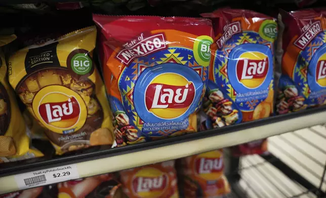 Lays chips with Thai writing and Mexican-style flavors are displayed for sale at Top Asian Food and Deli in Worthington, Minn., on Saturday, Oct. 19, 2024. (AP Photo/Jessie Wardarski)