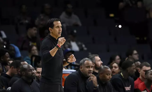 Miami Heat head coach Erik Spoelstra looks on during the second half of an NBA preseason basketball game against the Charlotte Hornets, Tuesday, Oct. 8, 2024, in Charlotte, N.C. (AP Photo/Matt Kelley)