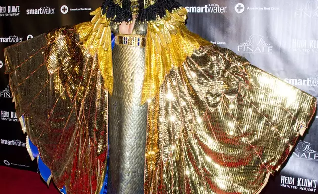 FILE - Heidi Klum, dressed as Cleopatra, attends her Haunted Holiday Party benefiting Superstorm Sandy relief efforts, on Saturday, Dec. 1, 2012 in New York (Photo by Charles Sykes/Invision/AP, File)