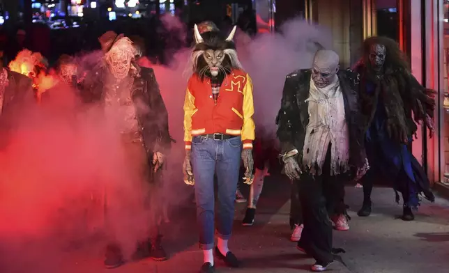 FILE - Heidi Klum, dressed as a werewolf, performs a dance from Michael Jackson's "Thriller" video her 18th Annual Halloween Party at Moxy Times Square on Tuesday, Oct. 31, 2017, in New York. (Photo by Evan Agostini/Invision/AP, File)