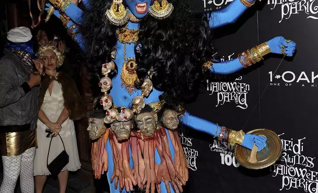 FILE - Heidi Klum, dressed as Kali, the Hindu goddess of death and time, attends her annual Halloween party at 1Oak on Friday, Oct. 31, 2008 in New York. (AP Photo/Evan Agostini, File)