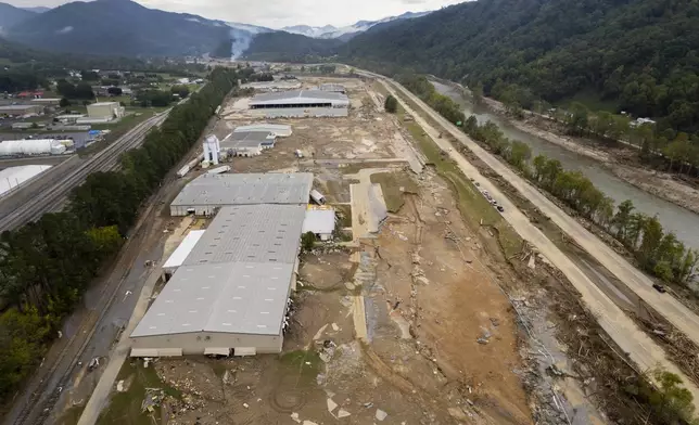 Damage caused by flooding from Hurricane Helene is seen around Impact Plastics in Erwin, Tenn., on Friday, Oct. 4, 2024. (AP Photo/Jeff Roberson)