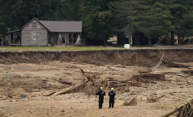 Personnel from Urban Search and Rescue Utah Task Force 1 continue to search for victims of the Impact Plastics tragedy in the aftermath of Hurricane Helene Friday, Oct. 4, 2024, in Erwin, Tenn. (AP Photo/Jeff Roberson)