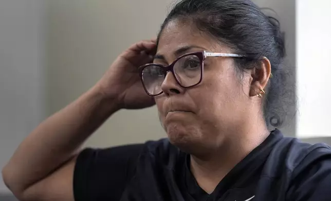 Anabel Andrade speaks about the loss of life at Impact Plastics as a result of flooding during Hurricane Helene Friday, Oct. 4, 2024, in Erwin, Tenn. (AP Photo/Jeff Roberson)