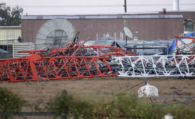 A view from the north side of the collapsed radio tower where a helicopter collided with the structure, killing all aboard Monday, Oct. 21, 2024 in Houston. (Michael Wyke/Houston Chronicle via AP)