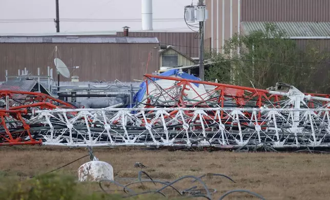 A view from the north side of the collapsed radio tower where a helicopter collided with the structure, killing all aboard Monday, Oct. 21, 2024 in Houston. (Michael Wyke/Houston Chronicle via AP)