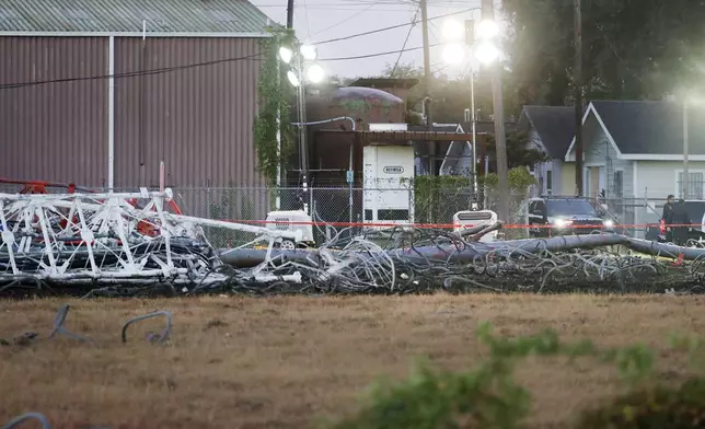 A view from the north side of the collapsed radio tower where a helicopter collided with the structure, killing all aboard Monday, Oct. 21, 2024 in Houston. (Michael Wyke/Houston Chronicle via AP)