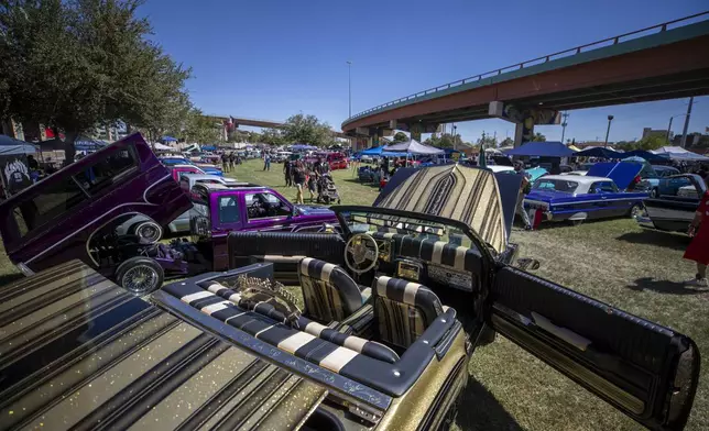 Vintage cars are pictured during a lowrider exhibition for the 20th anniversary of Lincoln Park in El Paso, Texas, Sunday, Sept. 22, 2024. (AP Photo/Andrés Leighton)