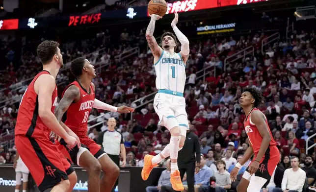 Charlotte Hornets guard LaMelo Ball (1) shoots against the Houston Rockets during the first half of an NBA basketball game Wednesday, Oct. 23, 2024, in Houston. (AP Photo/Eric Christian Smith)