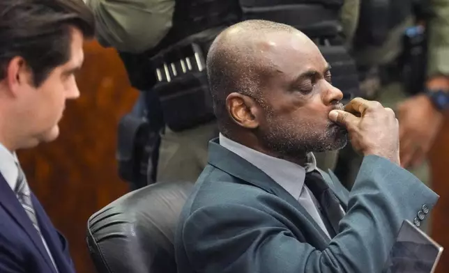 Former Houston police officer Gerald Goines sits in the courtroom after he was sentenced to 60 years behind bars on a pair of felony murder convictions on Tuesday, Oct. 8, 2024, in Houston. Goines was found guilty of felony murder in the 2019 deaths of Dennis Tuttle and Rhogena Nicholas. (Brett Coomer/Houston Chronicle via AP)