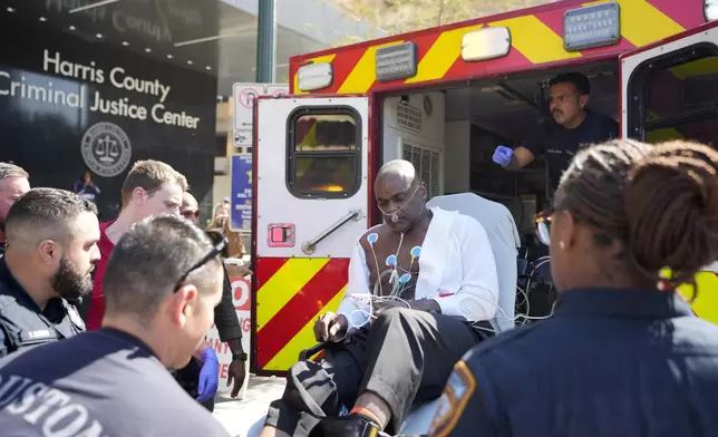 Former Houston police officer Gerald Goines is put into ambulance after having a medical emergency in the 482nd District Court at the Harris County Criminal courthouse during the punishment phase of his felony murder trial Thursday, Oct. 3, 2024, in Houston. (Melissa Phillip/Houston Chronicle via AP)