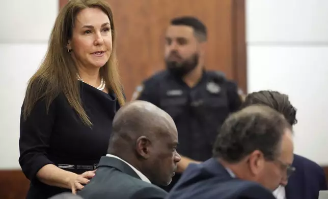 Defense attorney Nicole DeBorde speaks during closing arguments in the punishment phase in the felony murder trial of former Houston police officer Gerald Goines, center, Thursday, Oct. 3, 2024, at the Harris County Criminal courthouse in Houston. (Melissa Phillip/Houston Chronicle via AP)