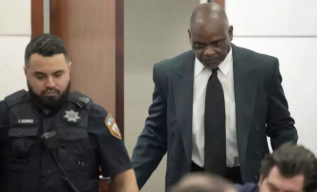 Former Houston police officer Gerald Goines is escorted in the 482nd District Court at the Harris County Criminal courthouse during the punishment phase of his felony murder trial Thursday, Oct. 3, 2024, in Houston. (Melissa Phillip/Houston Chronicle via AP)