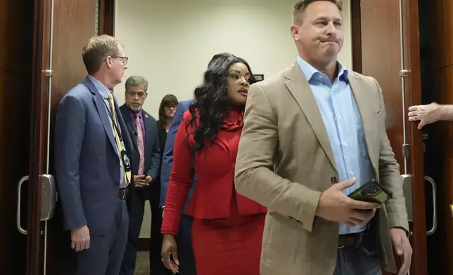 Ryan Tuttle, son of Dennis Tuttle, walks out of the courtroom after former Houston police officer Gerald Goines was sentenced to 60 years behind bars on a pair of felony murder convictions on Tuesday, Oct. 8, 2024, in Houston. Goines was found guilty of felony murder in the 2019 deaths of Dennis Tuttle and Rhogena Nicholas. (Brett Coomer/Houston Chronicle via AP)