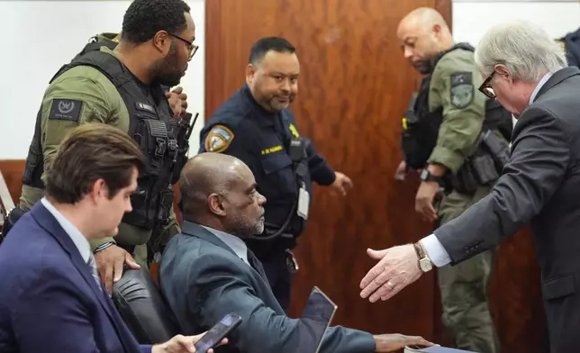 Former Houston police officer Gerald Goines sits in the courtroom after he was sentenced to 60 years behind bars on a pair of felony murder convictions on Tuesday, Oct. 8, 2024, in Houston. Goines was found guilty of felony murder in the 2019 deaths of Dennis Tuttle and Rhogena Nicholas. (Brett Coomer/Houston Chronicle via AP)