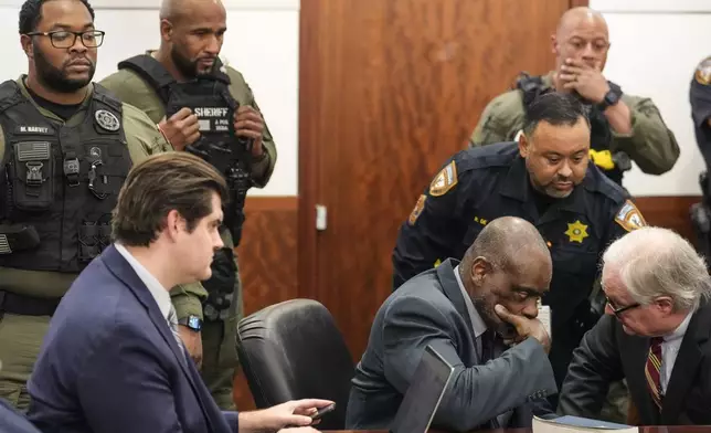 Former Houston police officer Gerald Goines sits in the courtroom after he was sentenced to 60 years behind bars on a pair of felony murder convictions on Tuesday, Oct. 8, 2024, in Houston. Goines was found guilty of felony murder in the 2019 deaths of Dennis Tuttle and Rhogena Nicholas. (Brett Coomer/Houston Chronicle via AP)