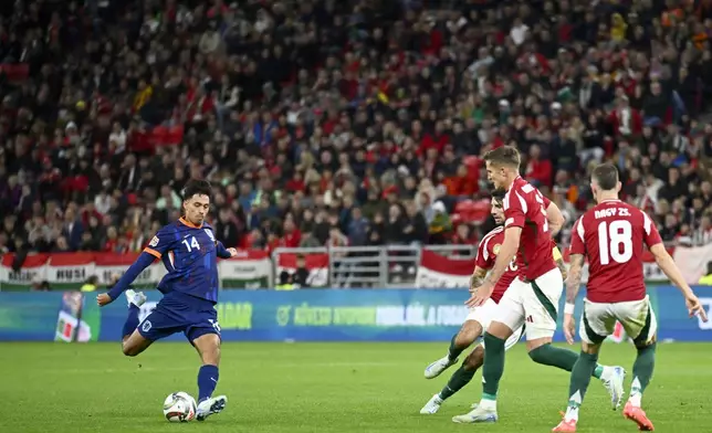 Tijjani Reijnders of the Netherlands attempts a shot at goal during the Nations League soccer match between Hungary and the Netherlands at the Puskas Arena in Budapest, Friday, Oct. 11, 2024. (AP Photo/Denes Erdos)