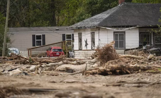 Homes lie in a debris field in the aftermath of Hurricane Helene, Thursday, Oct. 3, 2024, in Pensacola, N.C. (AP Photo/Mike Stewart)