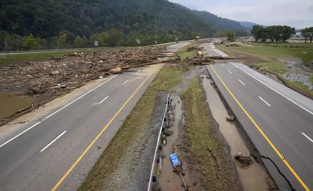 Debris covers the roadway along Interstate 26 in the aftermath of Hurricane Helene, Friday, Oct. 4, 2024, in Erwin, Tenn. (AP Photo/Jeff Roberson)