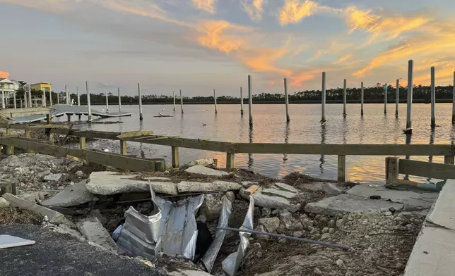 The sun sets over the storm-damaged Steinhatchee marina near where the Steinhatchee River flows into the Gulf of Mexico, Sunday, Sept. 29, 2024, in the aftermath of Hurricane Helen. (AP Photo/Kate Payne) Kate Payne Reporter, State Government Education Tallahassee, FL C 850.545.4283 kpayne@ap.or