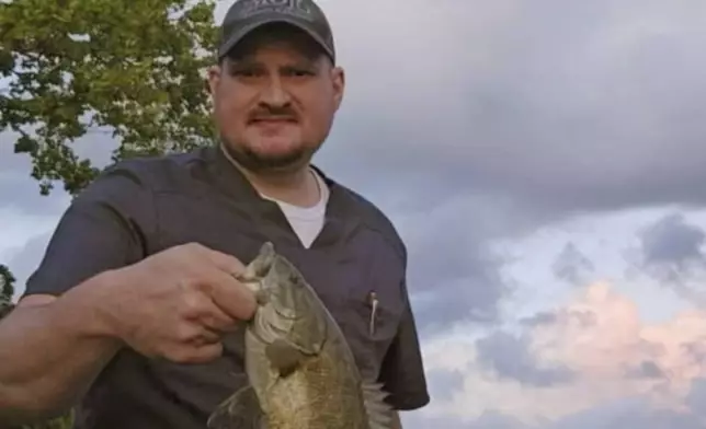 This undated photo shows Boone McCrary, of Greeneville, Tenn., who died after his boat capsized while he was trying to rescue a man trapped in the river during Hurricane Helene. (Laura Harville via AP)