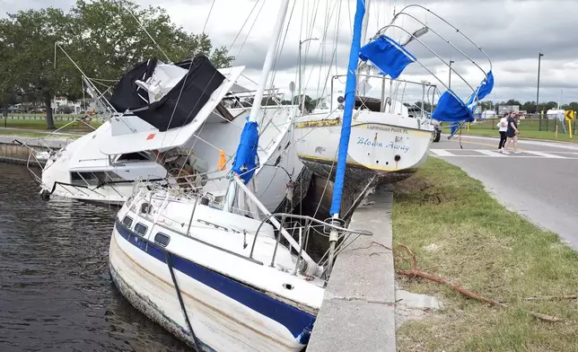 Boats destroyed during Hurricane Helene are shown on the Davis Islands Yacht Basin ahead of the possible arrival of Hurricane Milton Monday, Oct. 7, 2024, in Tampa, Fla. (AP Photo/Chris O'Meara)