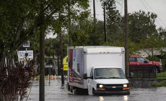 High water is seen near Hillsborough street in the aftermath of hurricane Milton, Thursday, Oct. 10, 2024, in Tampa, Fla. (AP Photo/Mike Stewart)