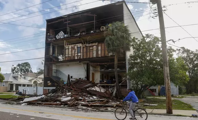 A building loses its front side around the Palmetto Beach neighborhood after Hurricane Milton on Thursday, Oct. 10, 2024, in Tampa, Fla. (Jefferee Woo/Tampa Bay Times via AP)