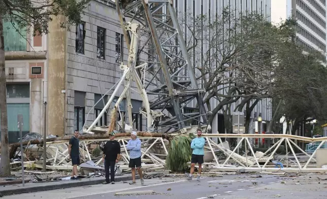 A construction crane fell over into an office building that houses the Tampa Bay Times headquarters, after Hurricane Milton, Thursday, Oct. 10, 2024. (Tampa Bay Times via AP)