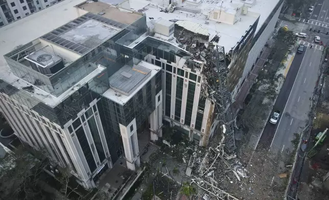 A construction crane fell over into an office building that houses the Tampa Bay Times headquarters, Thursday, Oct. 10, 2024. (Tampa Bay Times via AP)