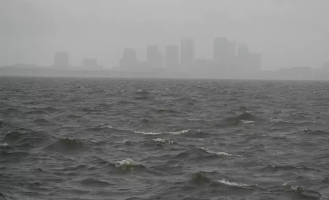 Rain begins to fall ahead of the arrival of Hurricane Milton, Wednesday, Oct. 9, 2024, in Tampa, Fla. (AP Photo/Julio Cortez)