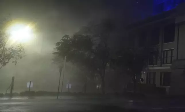 Wind-driven rain soaks a street in downtown Tampa, Fla., during the passage of Hurricane Milton, Wednesday, Oct. 9, 2024. (AP Photo/Rebecca Blackwell)