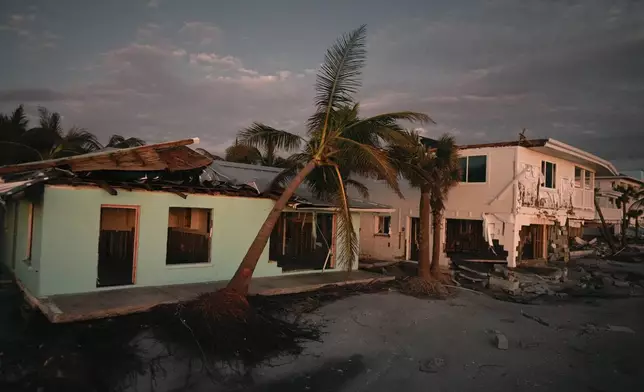 Damaged homes are seen on Manasota Key, Fla., following the passage of Hurricane Milton, Saturday, Oct. 12, 2024. (AP Photo/Rebecca Blackwell)